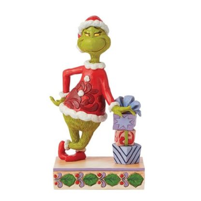 Figura Grinch encostado nos Presentes de Natal